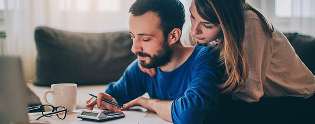 couple using calculator