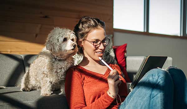 woman on sofa with dog