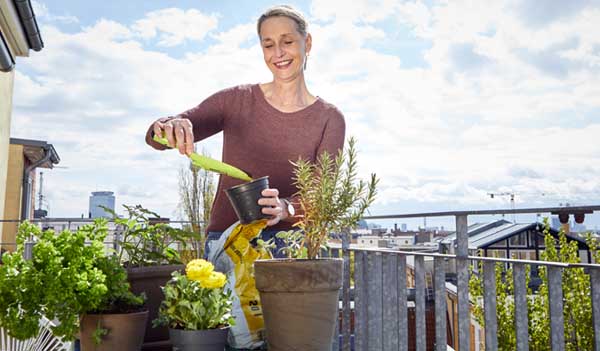 Person gardening on balcony