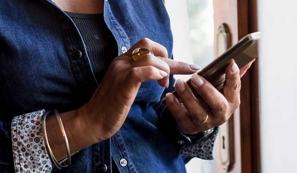 Older woman hands holding phone