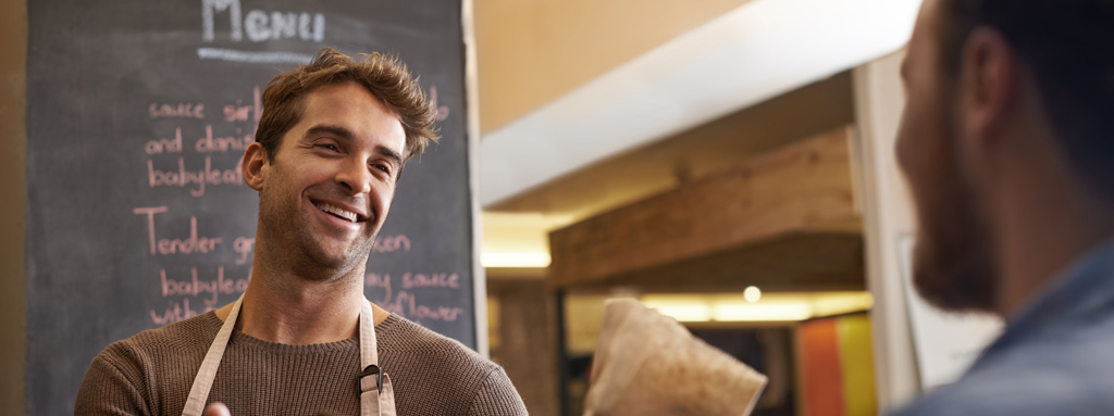 two guys talking in a coffee shop