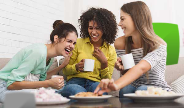 Women enjoying biscuits and cake