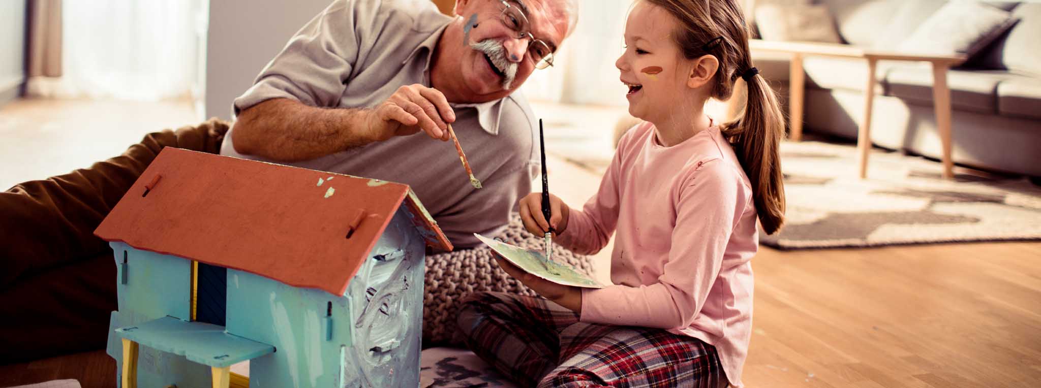 Grandfather and grandchild playing house