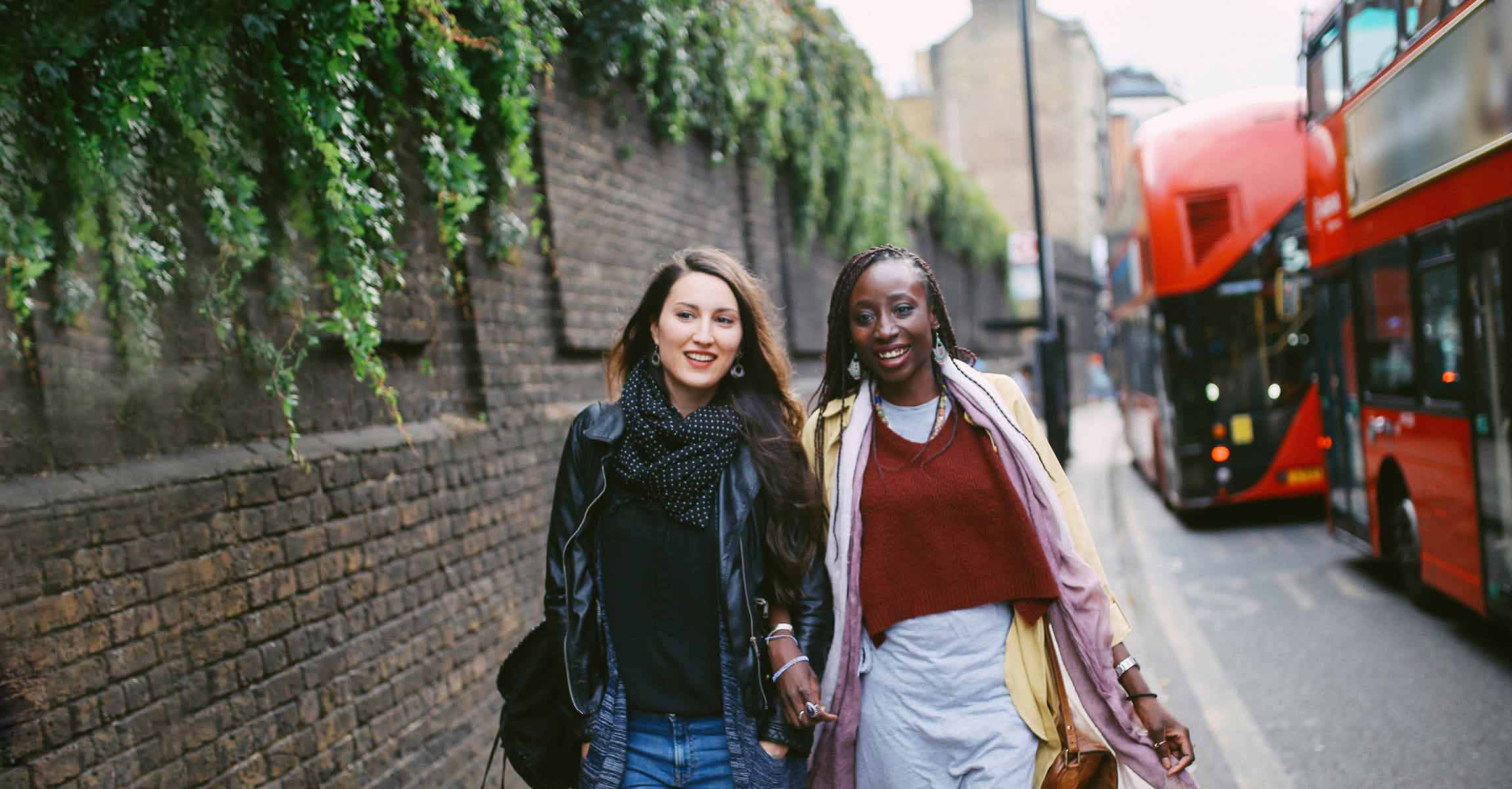 women standing near busses