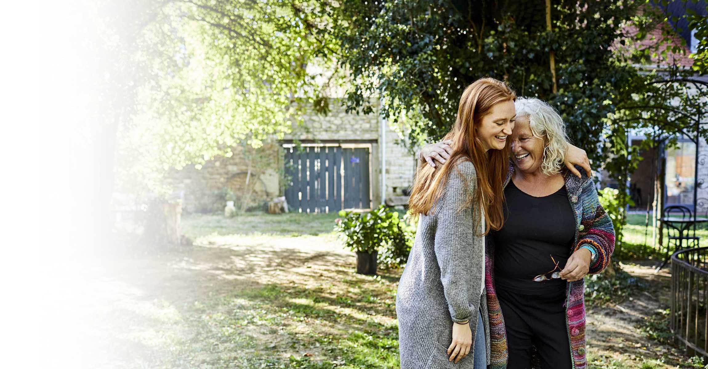 Young and old women hugging